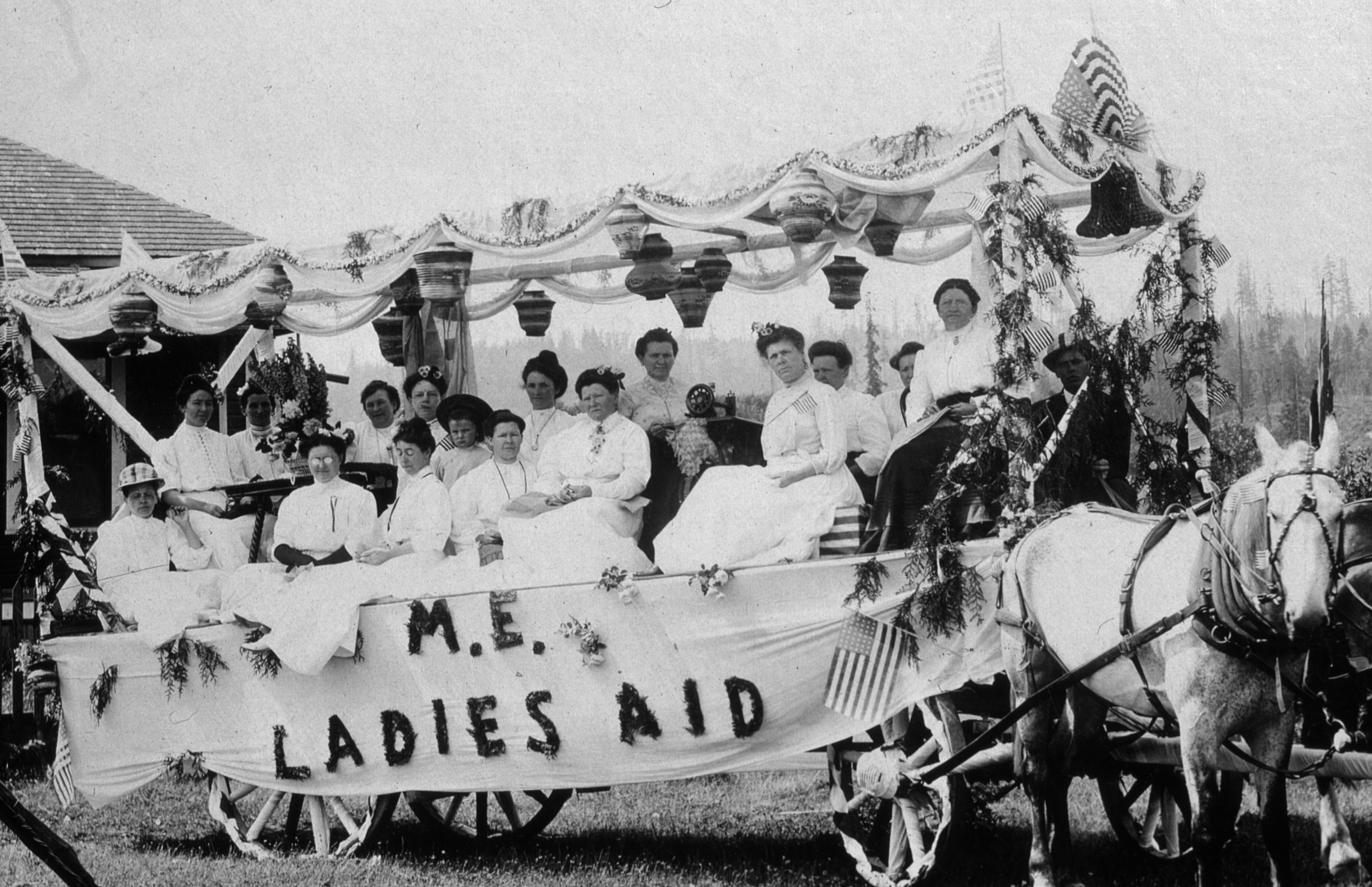 The 1908 float of the Methodist Ladies Aid Society in the Bothell 4th of July Parade. The official name of the church was Methodist Episcopal (because church hierarchy had bishops), hence the initials M. E.