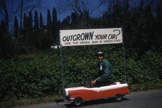 1958 Bothell 4th of July parade--Ron Green is the Green Man at Green Ford