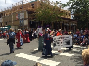 Bothell Historical Museum volunteers celebrate the 106th anniversary of women's right to vote in the State of Washington. Bothell 2016 4th of July parade, looking sotheast at the corner of Main Street and 102 Avenue NE.