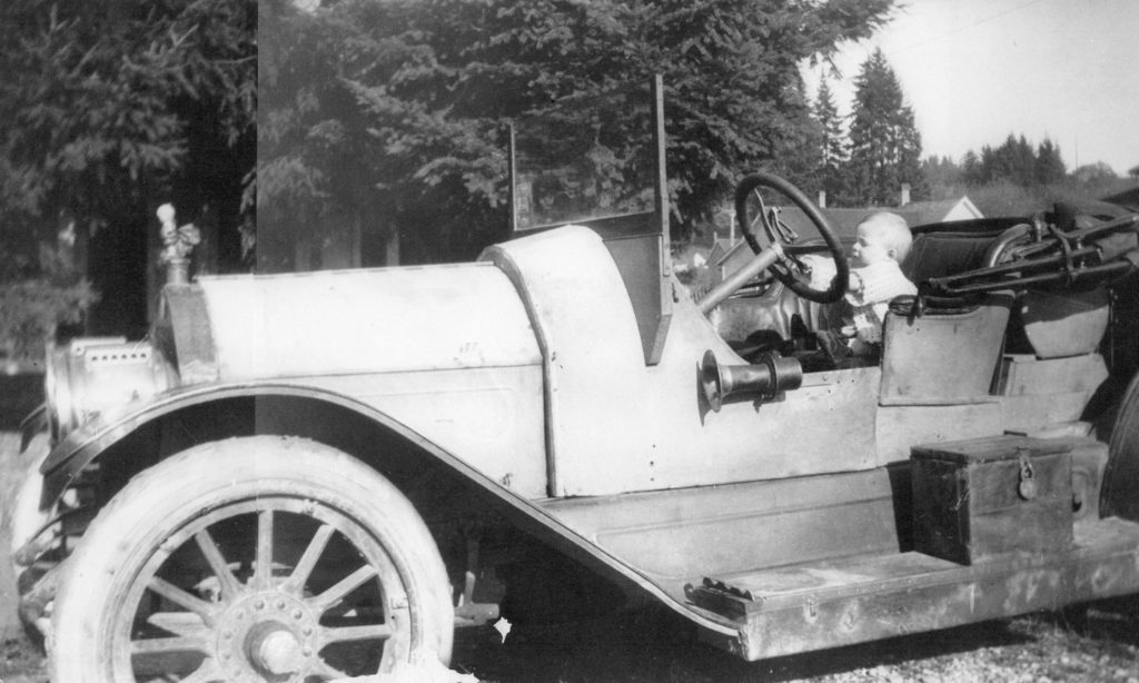 Young driver Ron Green at the wheel of the Mighty Michigan